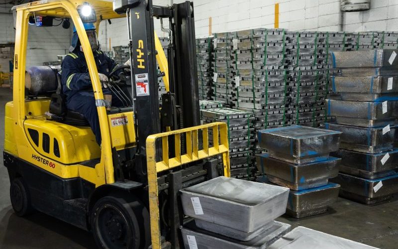 Forklift with lead ingots and stacks of recycled lead ingots to supply raw materials to manufacturers. Forklift with lead ingots and stacks of recycled lead ingots to supply raw materials to manufacturers.