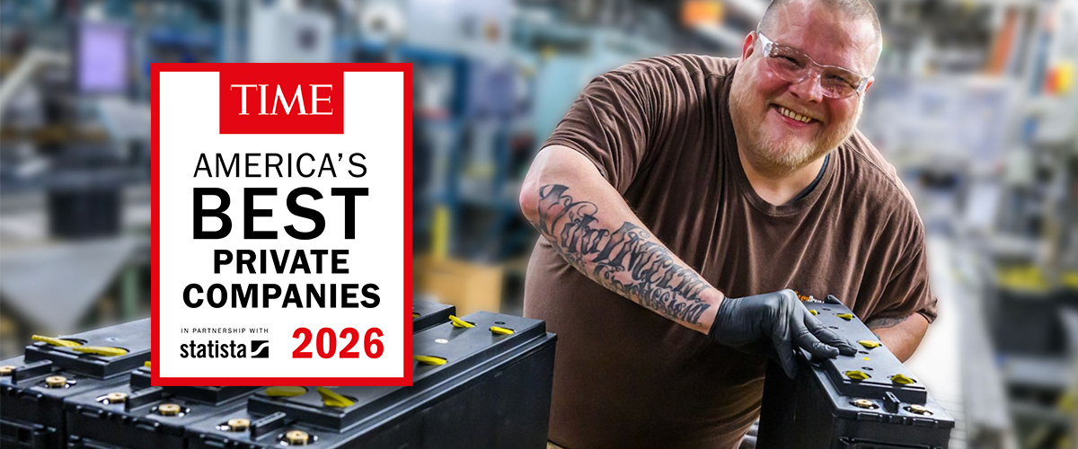 East Penn Manufacturing employee handling lead batteries in a production facility alongside the TIME America's Best Private Companies 2026 award graphic recognizing East Penn as one of America's top private companies.