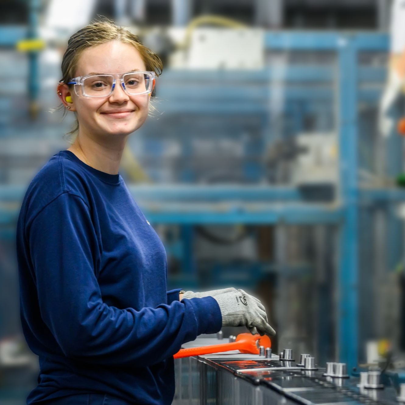 East Penn Manufacturing employee at a battery manufacturing facility recognizing East Penn's leadership in battery manufacturing, recycling, and American manufacturing.